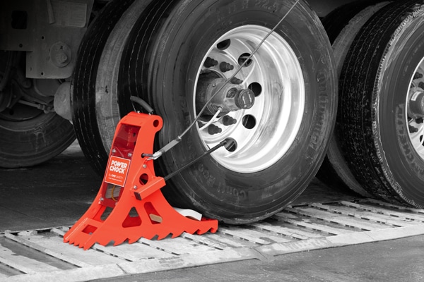 POWER CHOCK® 3 wheel-based vehicle restraint system, holding the truck wheel on the restraining plate